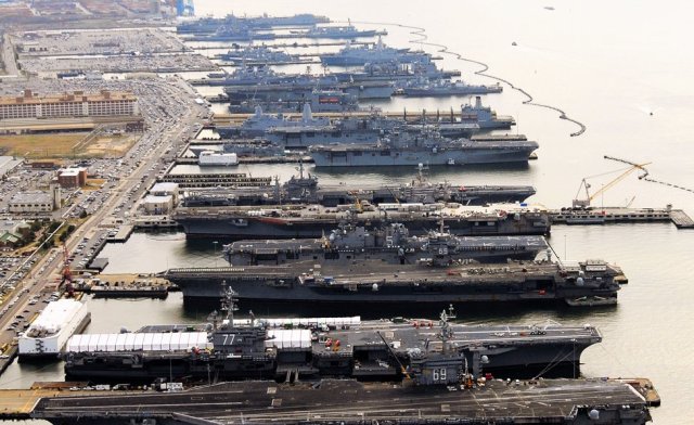 USS Dwight D. Eisenhower (CVN 69), USS George H.W. Bush (CVN 77), USS Enterprise (CVN 65), USS Harry S. Truman (CVN 75), and USS Abraham Lincoln (CVN 72) are in port at Naval Station Norfolk, Va., the world’s largest naval station Read more: http://www.businessinsider.com/the-worlds-largest-naval-station-is-packed-tight-for-christmas-2012-12#ixzz2PZuF6MHh